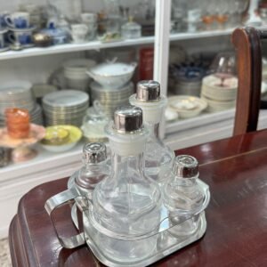 Set salero, pimentero, aceitera, vinagrera con el soporte