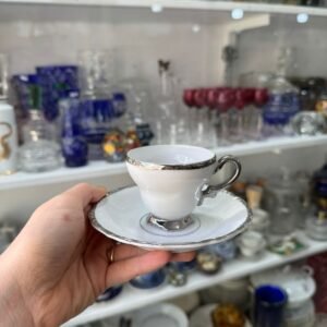 Dúo de café porcelana con platería