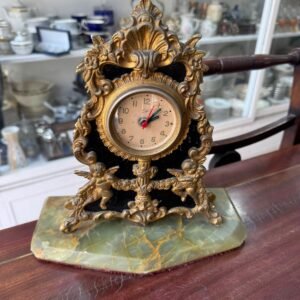 Reloj de bronce con marmol