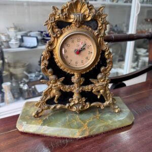 Reloj de bronce con marmol