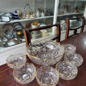 Juego de fuente con 6 compoteras vidrio prensado con guarda dorada