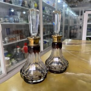 Par de botellones o perfumeros de cristal rubi con bronce